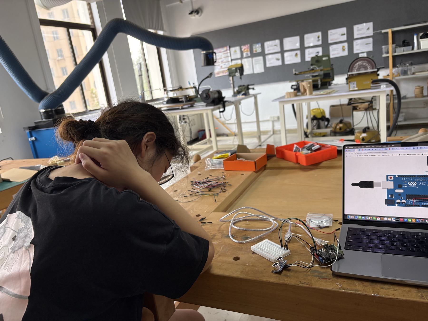 Students assembling a full-scale interactive visual merchandising prototype in the studio